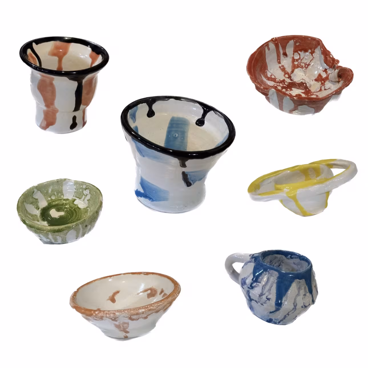 Seven hand-built cups and small bowls with dripped glazes in black, blue, green, rust and yellow.