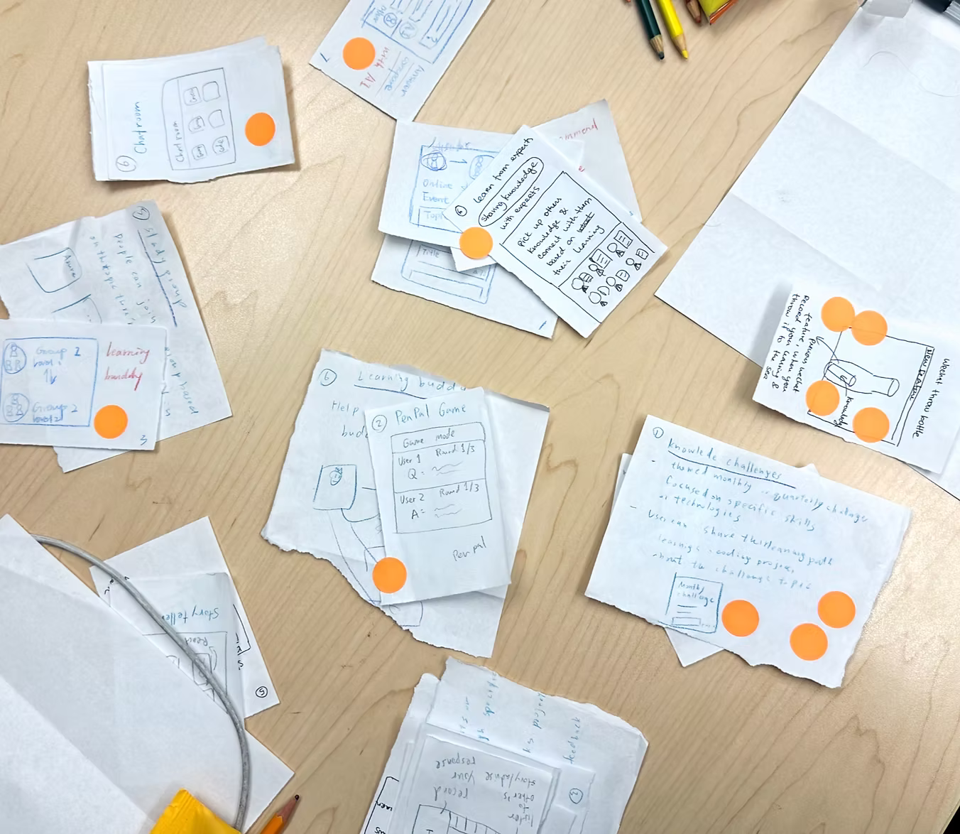 Crazy 8s sketches spread on a table